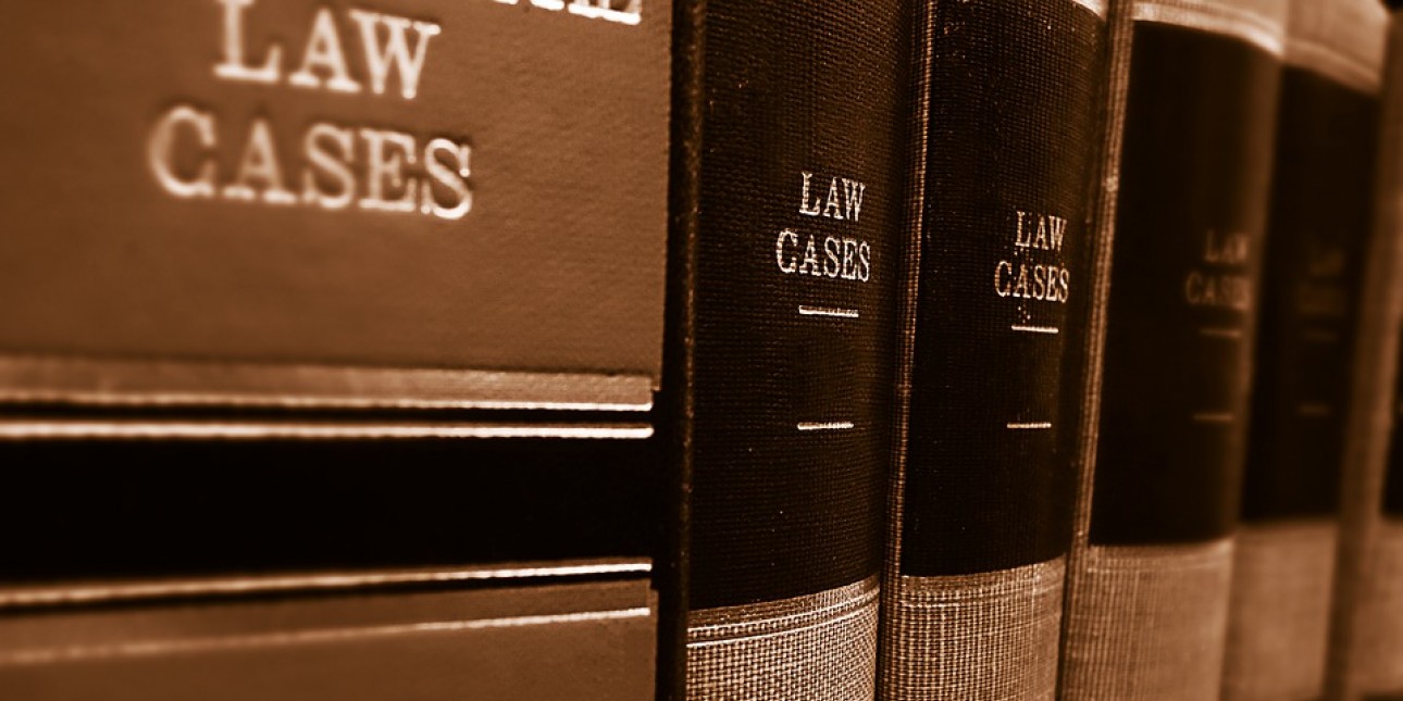 Law books lined up on a shelf