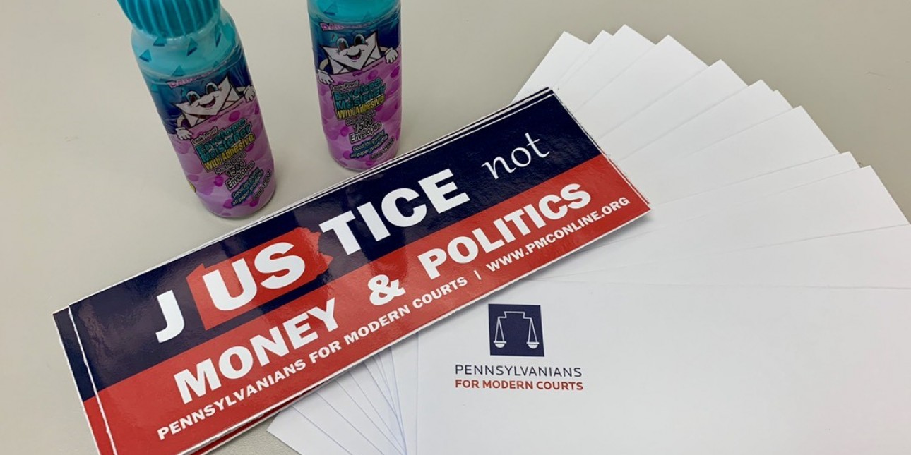 PMC envelopes, bumper stickers, and envelope moistener used during a fundraising mailing
