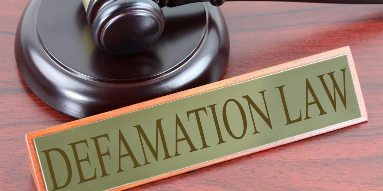 "Defamation Law" desk plate with gavel