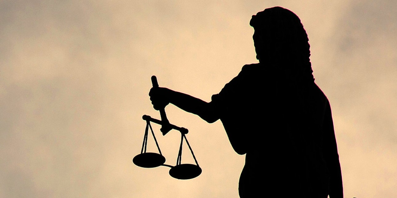 Silhouette of Lady Justice statue