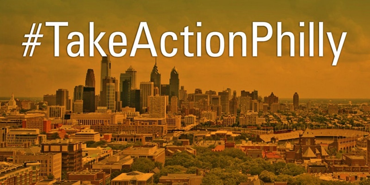 #TakeActionPhilly in front of Philadelphia's skyline
