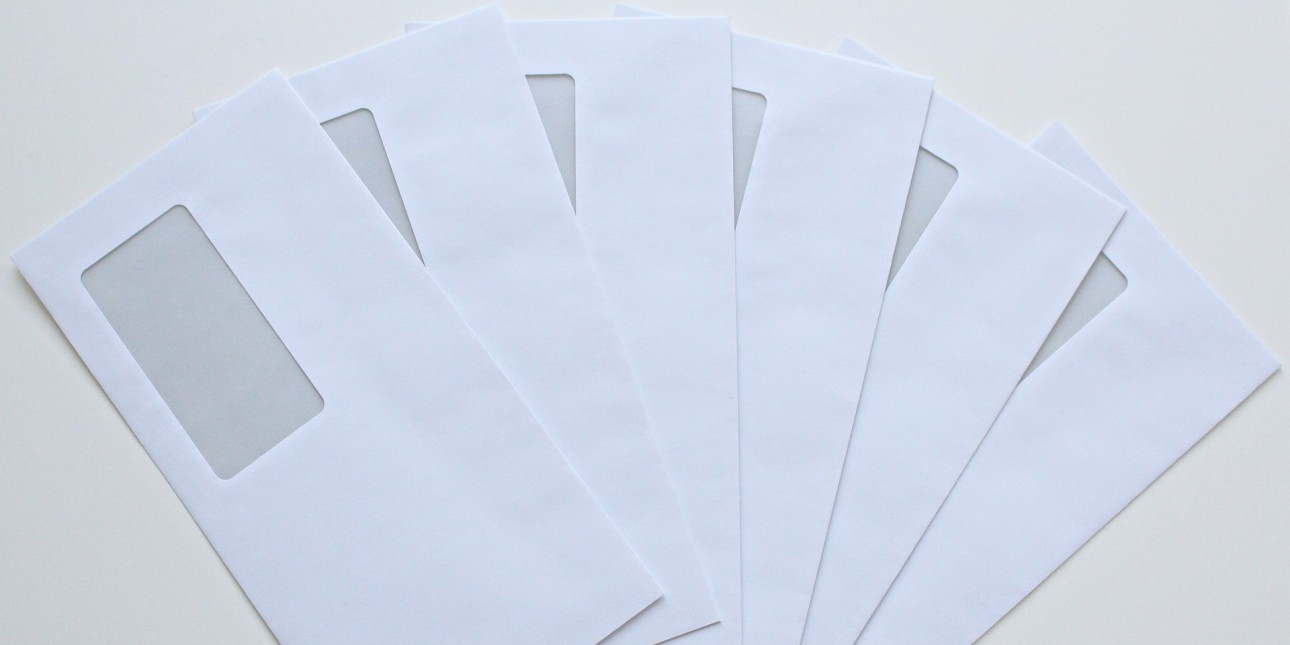 Envelopes spread out on a desk