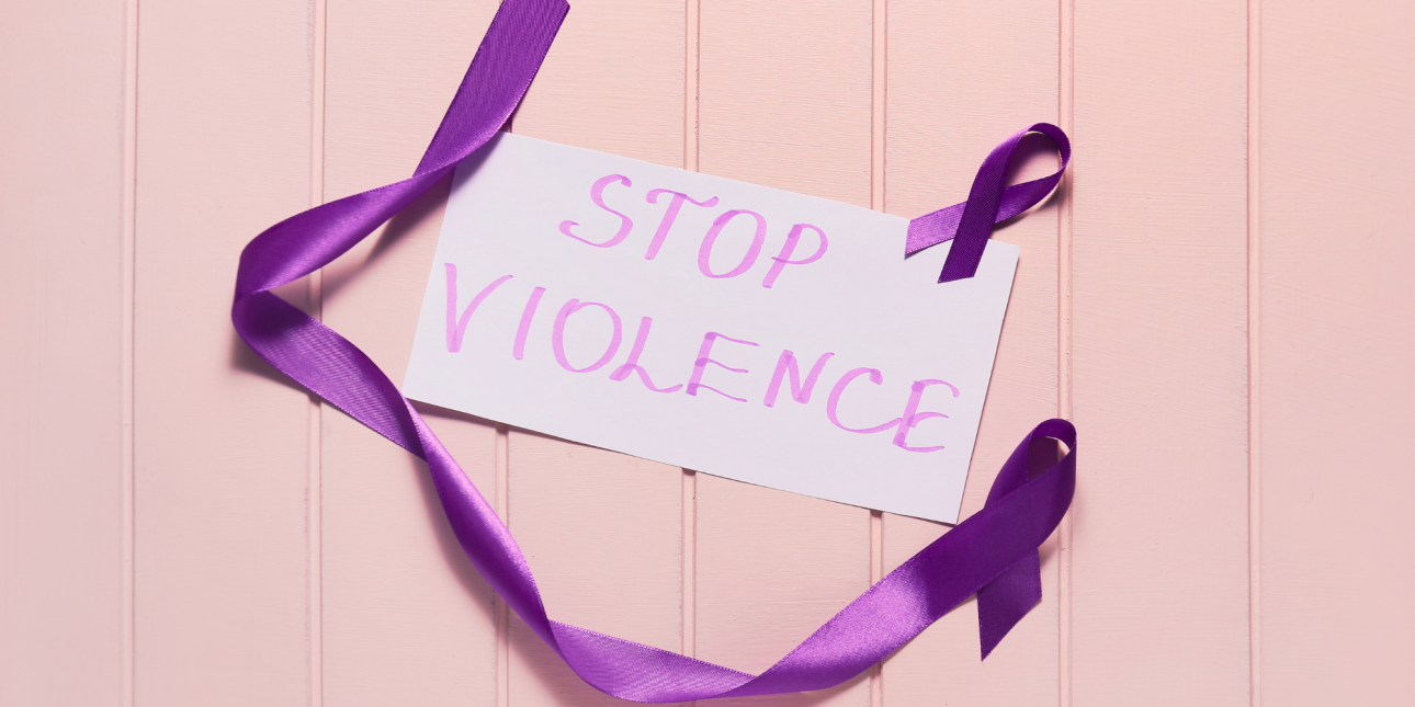 purple domestic violence awareness ribbon with a sign that says "Stop Violence"