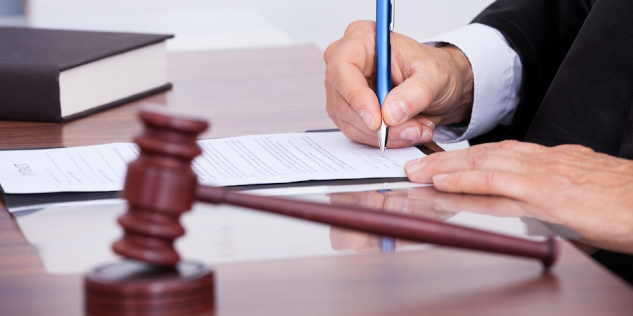 Judge signing a PFA