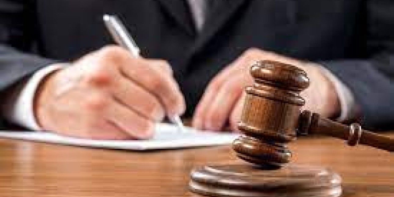 gavel and paper being signed