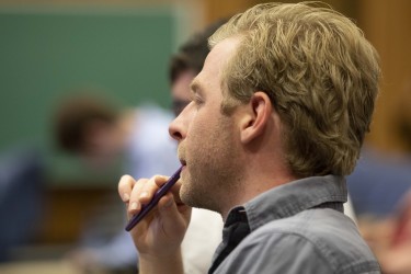 A journalist listening to a presentation at a One-Day Law School for Journalists™ at the University of Pittsburgh School of Law