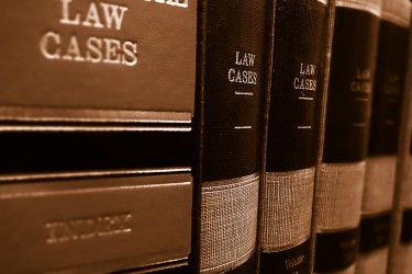 Law books lined up on a shelf