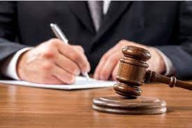 gavel and paper being signed